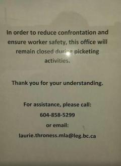 Photo of sign in from of Liberal MLA's Constituency Office